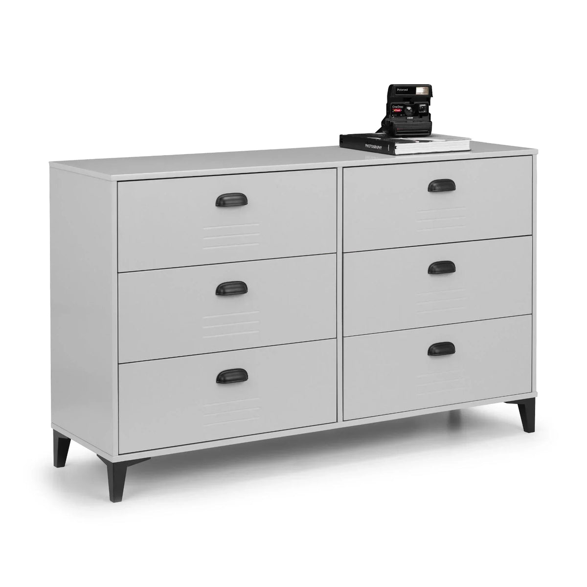 Grey locker style 6 drawer chest with black handles and legs, camera and books on top