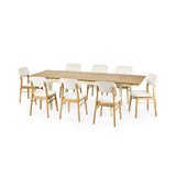 Extended rectangular dining table with cream legs and natural wood top surrounded by eight cushioned wooden chairs.