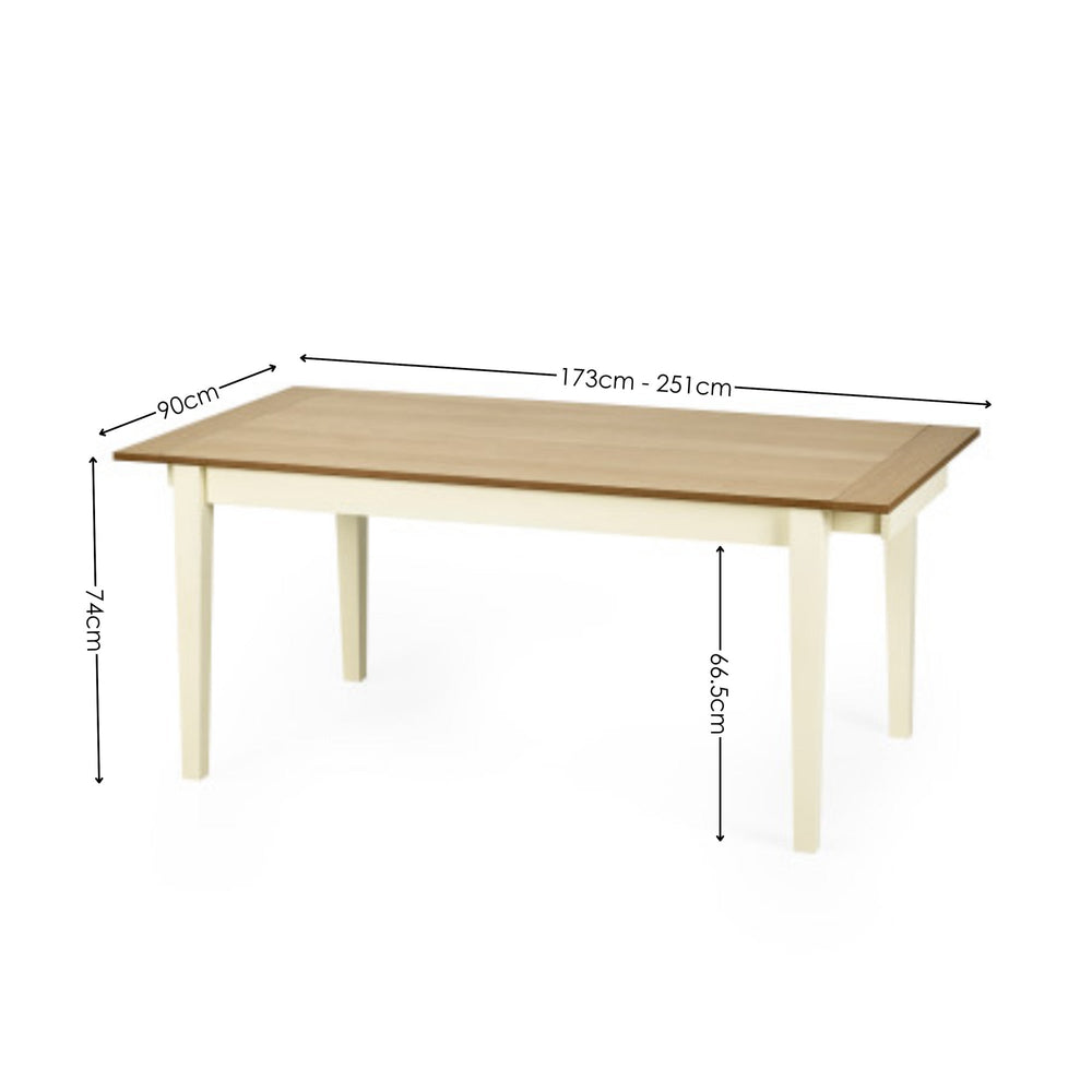 Rectangular wooden dining table with a light natural wood top and cream painted legs with measurements.