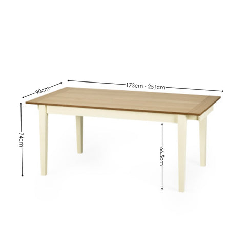 Rectangular wooden dining table with a light natural wood top and cream painted legs with measurements.