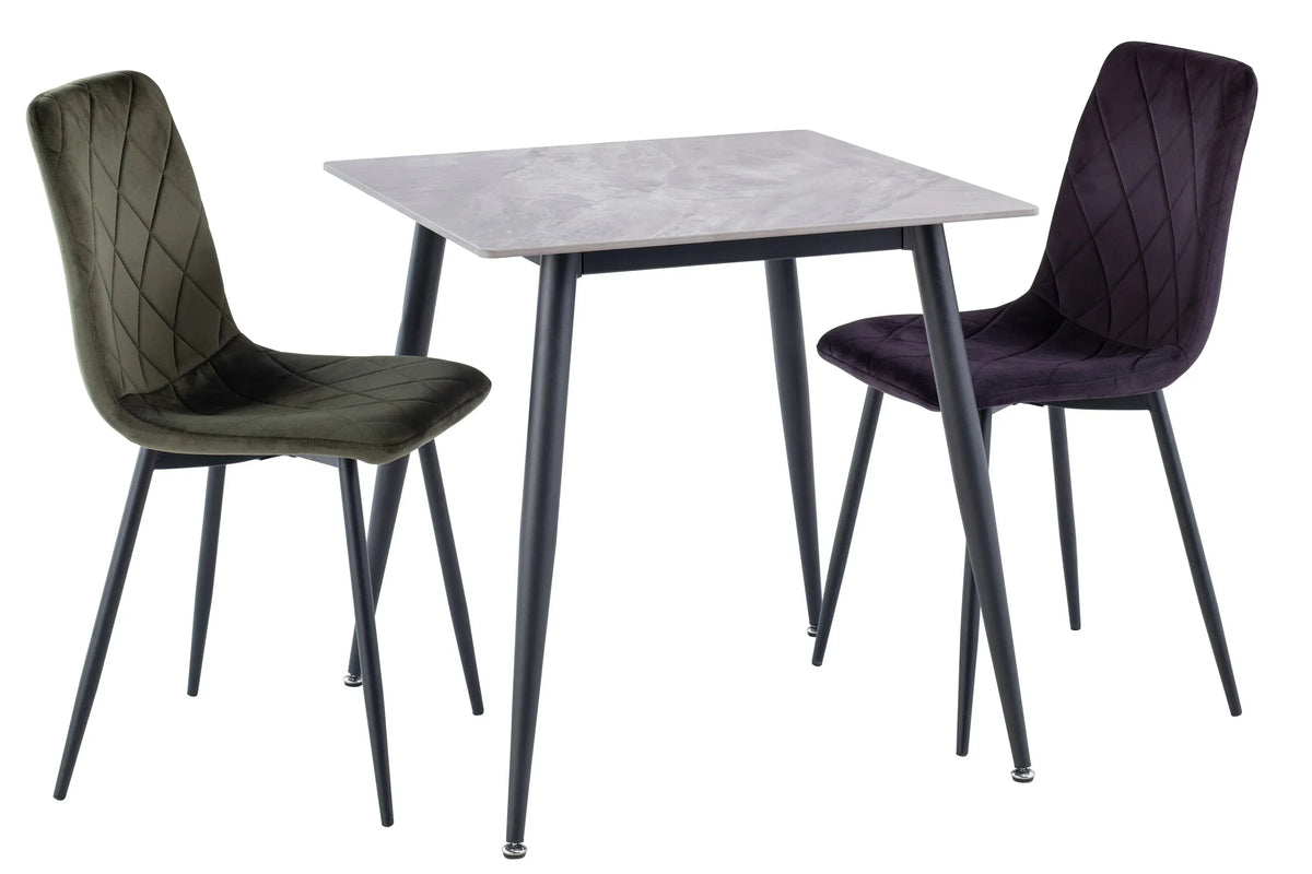 Velvet dining chair with diamond quilted backrest next to square marble dining table