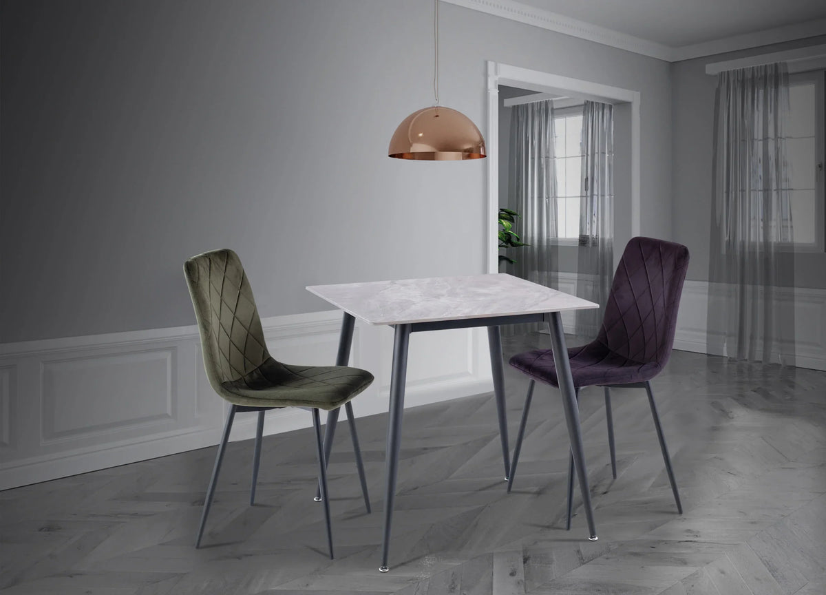 Bella velvet dining chairs with metal legs and marble dining table in modern room
