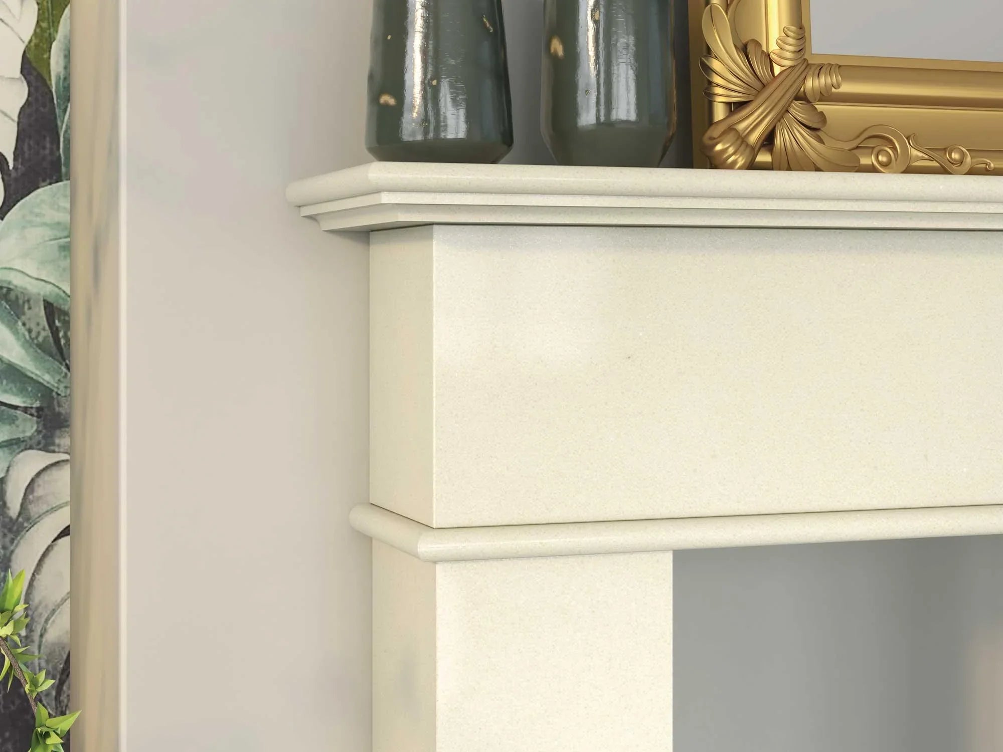 Cream stone fireplace mantel with decorative vases and gold photo frame on top