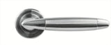 brushed chrome door handle on round rose, modern design, close up view