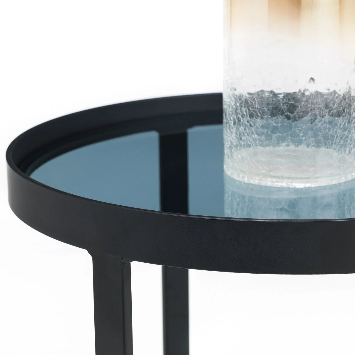 Smoked glass lamp table with black metal frame and close-up of textured glass decor