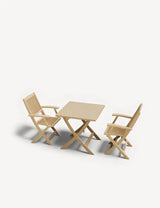 Light wood dining set with square table, two slatted armchairs on white background