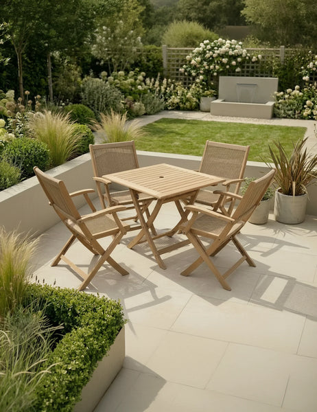 Wooden garden dining set with four chairs on patio, surrounded by greenery and modern landscaping