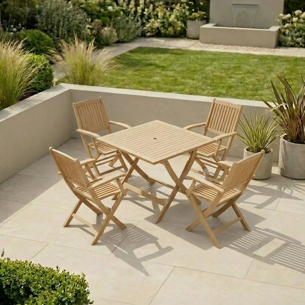 Wooden garden dining set with four chairs and a square table on a patio