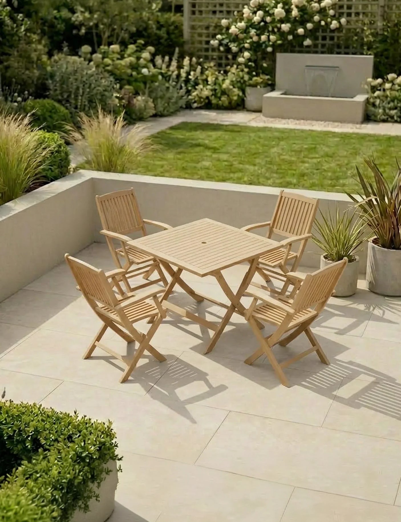 Wooden garden dining set with four chairs and a square table on a patio