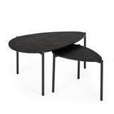 Side angle isolated view of black wood teardrop nesting coffee tables with three metal legs each