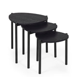 Black teardrop nesting side tables stacked beside each other on white background showing front corner angle.