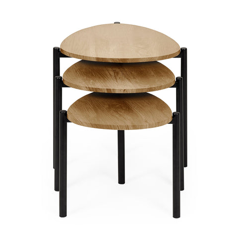 Three nested teardrop side tables with light wood tops stacked with black metal legs, front view.