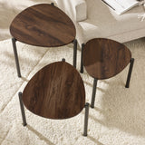 Top view of three dark wood teardrop nesting side tables with black metal legs arranged on soft white rug.