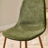 Green fabric dining chair with wooden legs, close up of seat and backrest