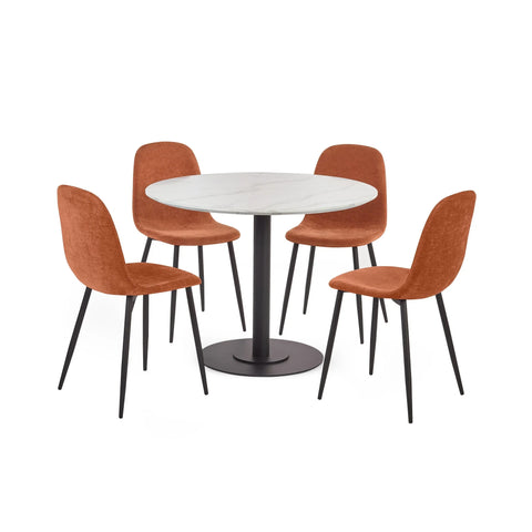 Round white marble dining table with black pedestal base and four orange upholstered chairs
