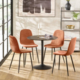 Modern dining table set with four orange fabric chairs and round black table