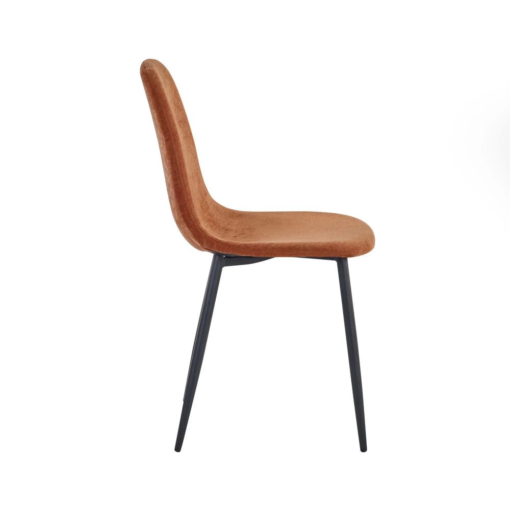 Side view of brown velvet dining chair with black metal legs