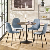 Round dining table set with four blue fabric chairs in modern dining room