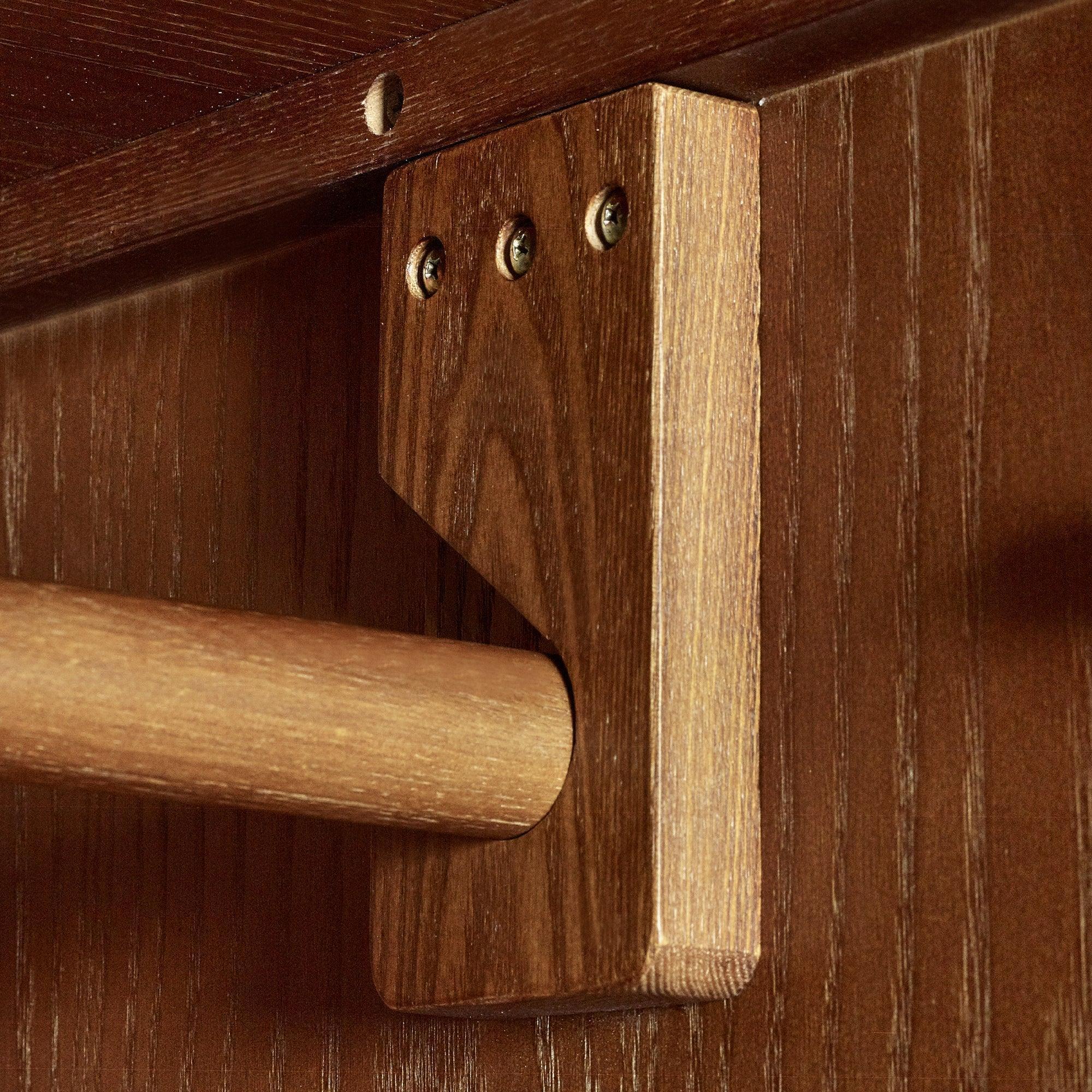 Lowry 2 door 1 drawer wardrobe close-up of oak hanging rail and wood grain texture