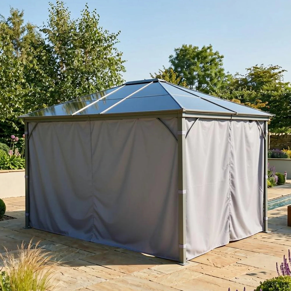 Garden gazebo with metal frame and closed grey curtains on stone patio