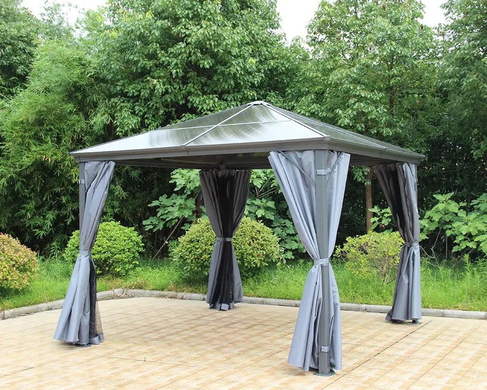Grey metal garden gazebo with curtains on patio, surrounded by greenery