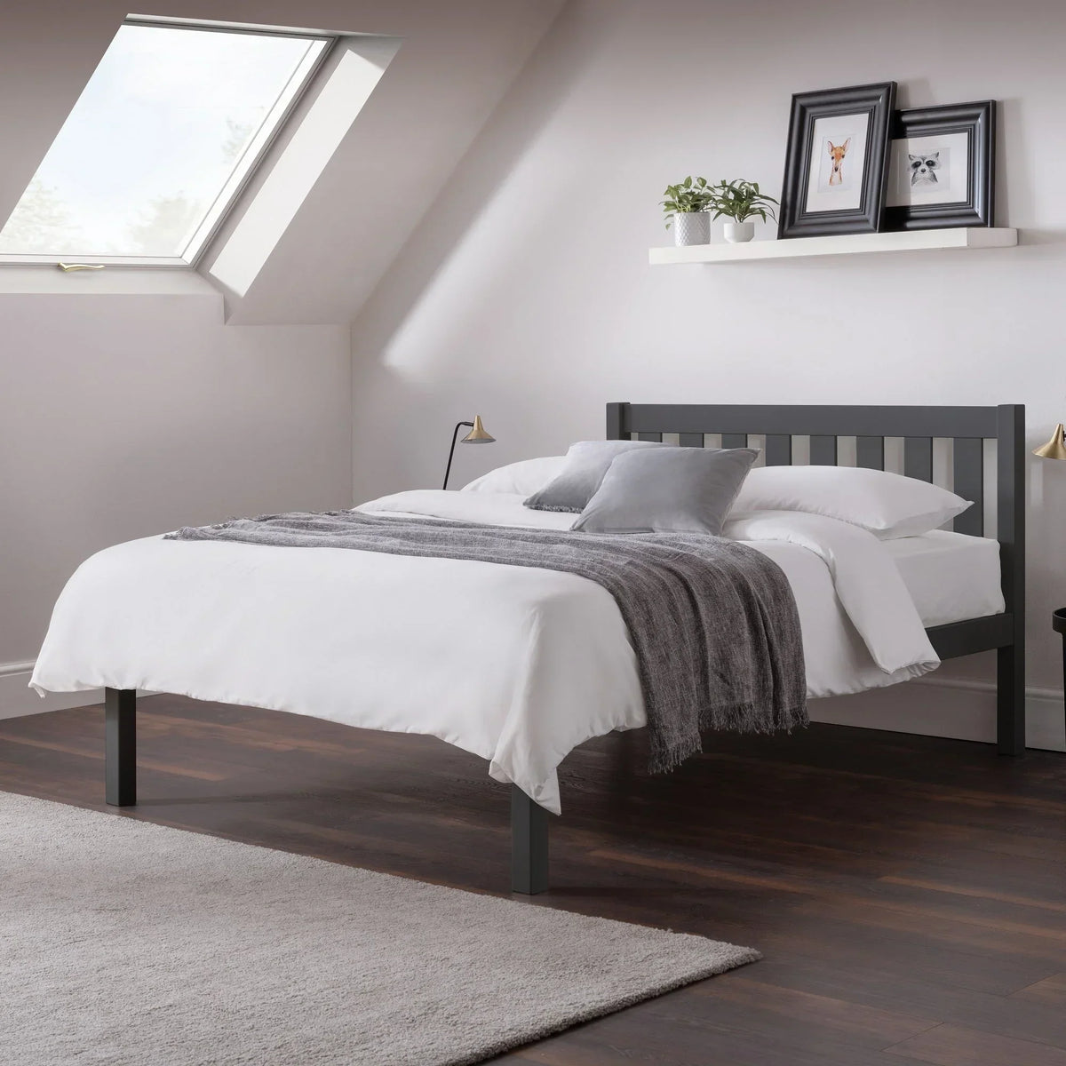 Anthracite double bed with slatted headboard in modern bedroom, white bedding, grey throw
