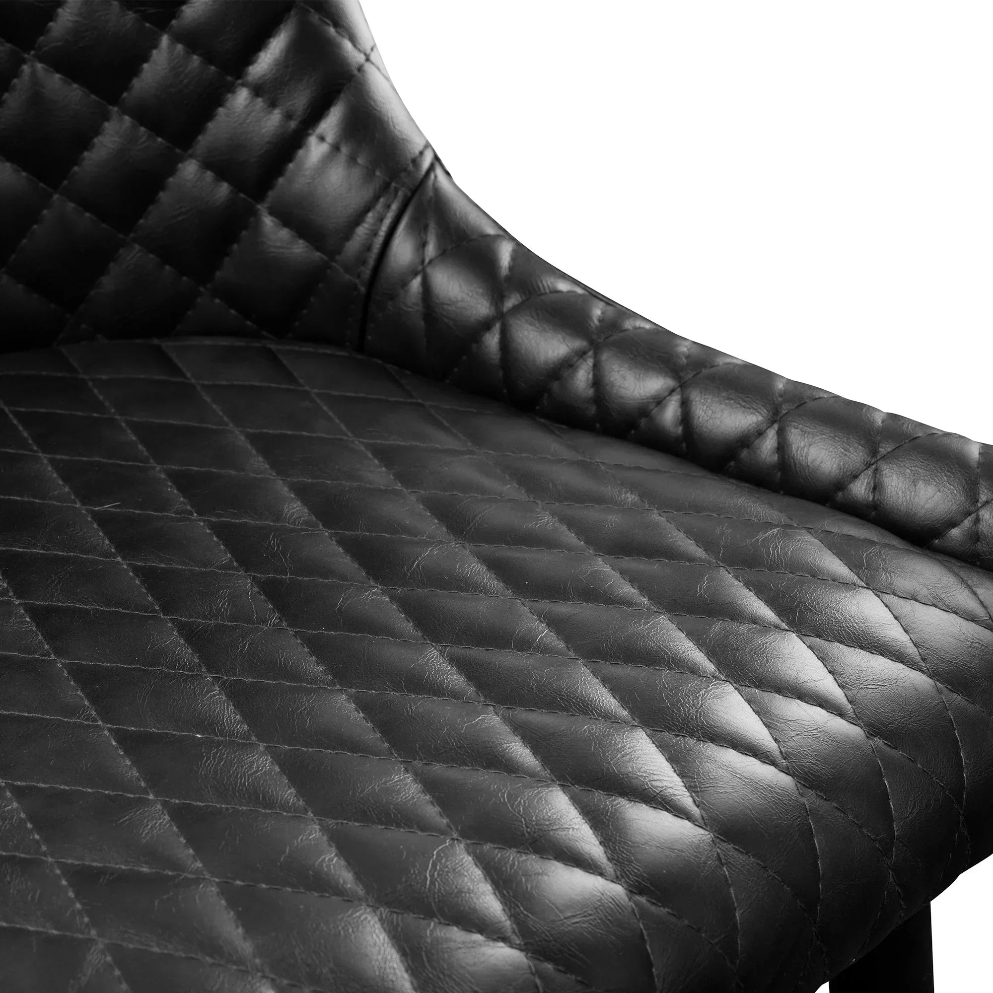 Close-up of black faux leather bar stool with quilted diamond stitching detail