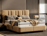 Deep quilted mattress styled with cushions and throws in contemporary bedroom