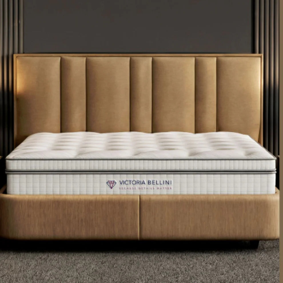 Upholstered headboard with deep tufted mattress in warm neutral bedroom setting