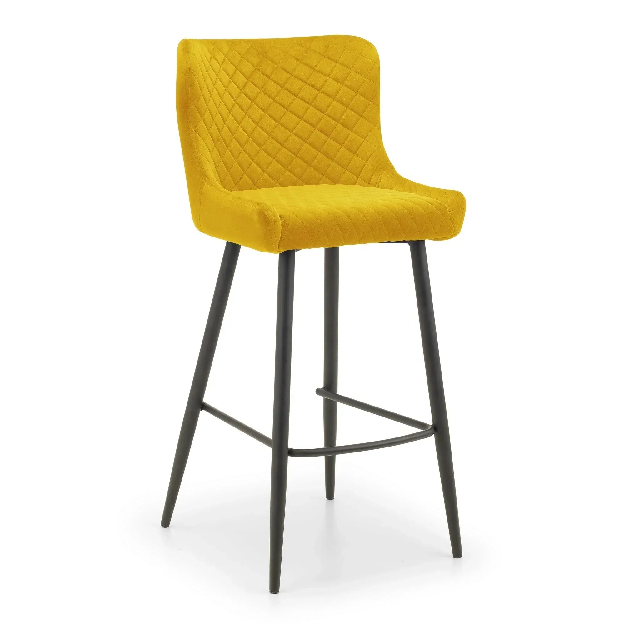 Mustard velvet bar stool with quilted backrest and black metal legs on white background