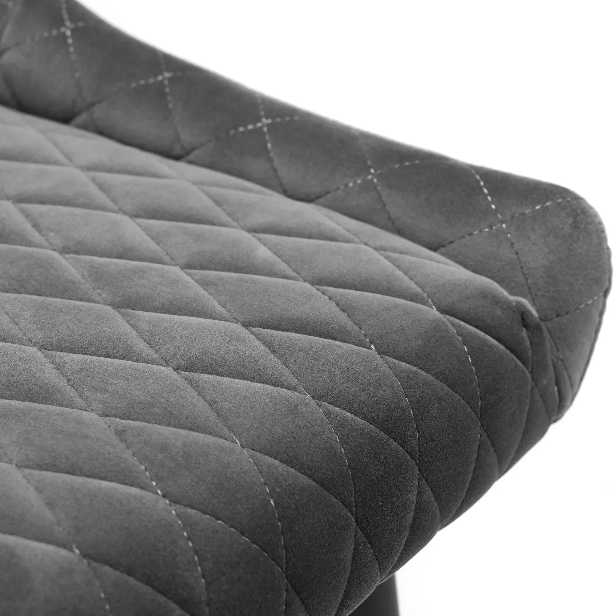 Grey bar stool seat with diamond quilted upholstery and soft velvet texture, close detail view