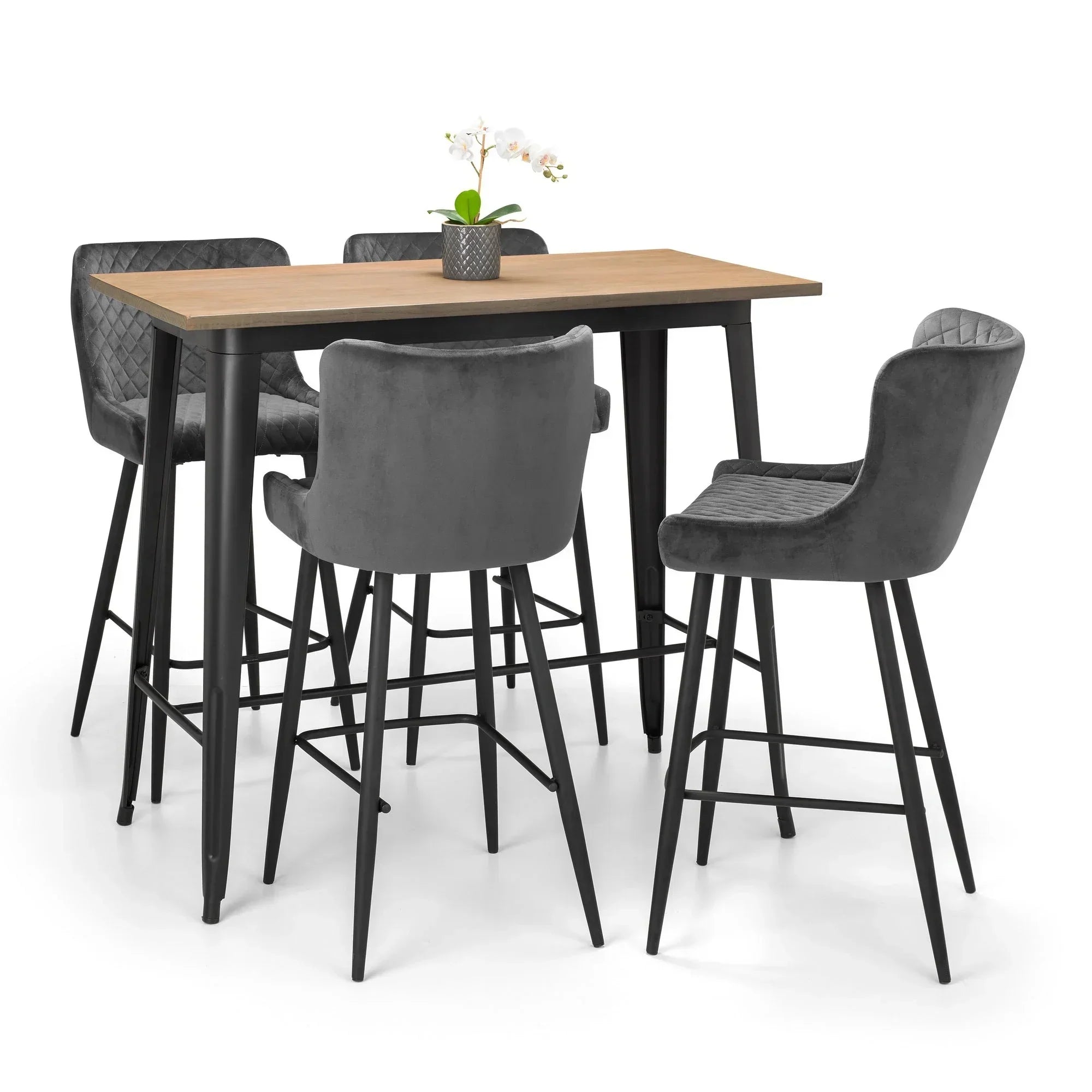 Luxe grey bar stools with quilted backrests around a wooden bar table on white background