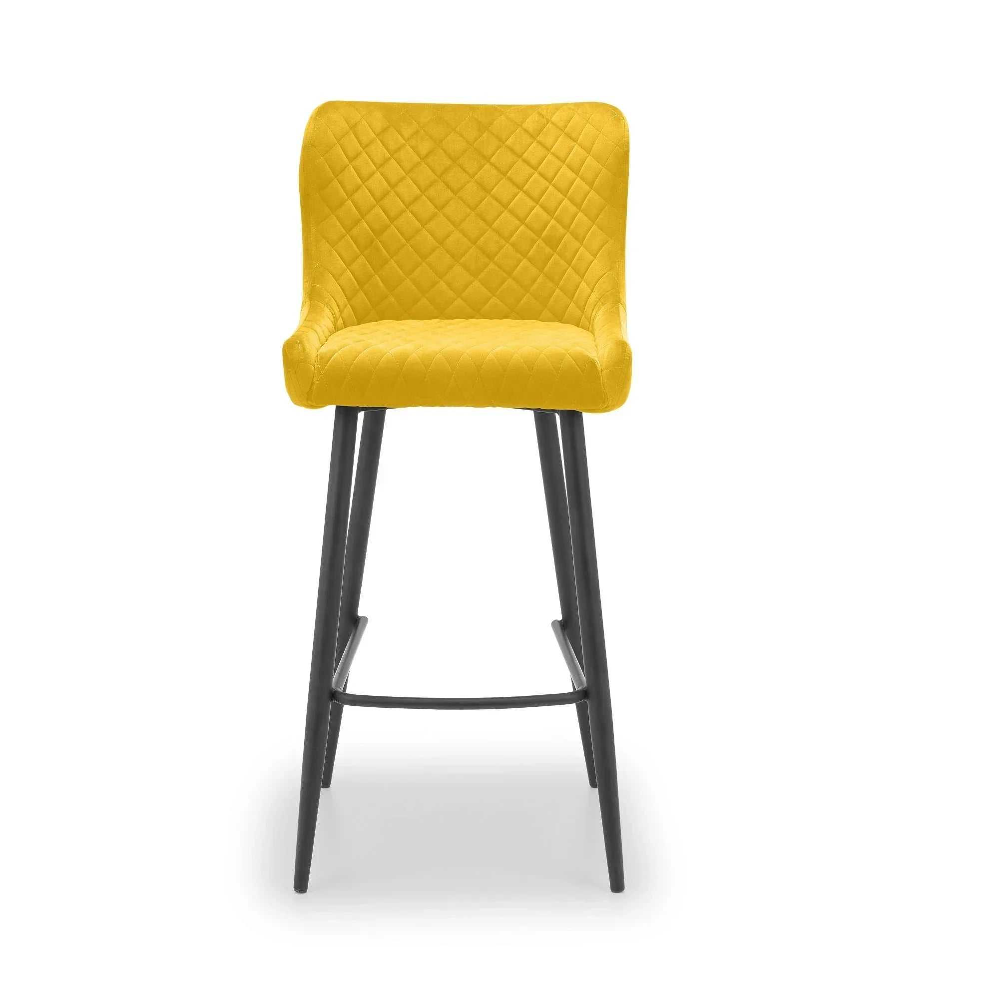 Mustard bar stool with quilted fabric seat and black metal legs, front view