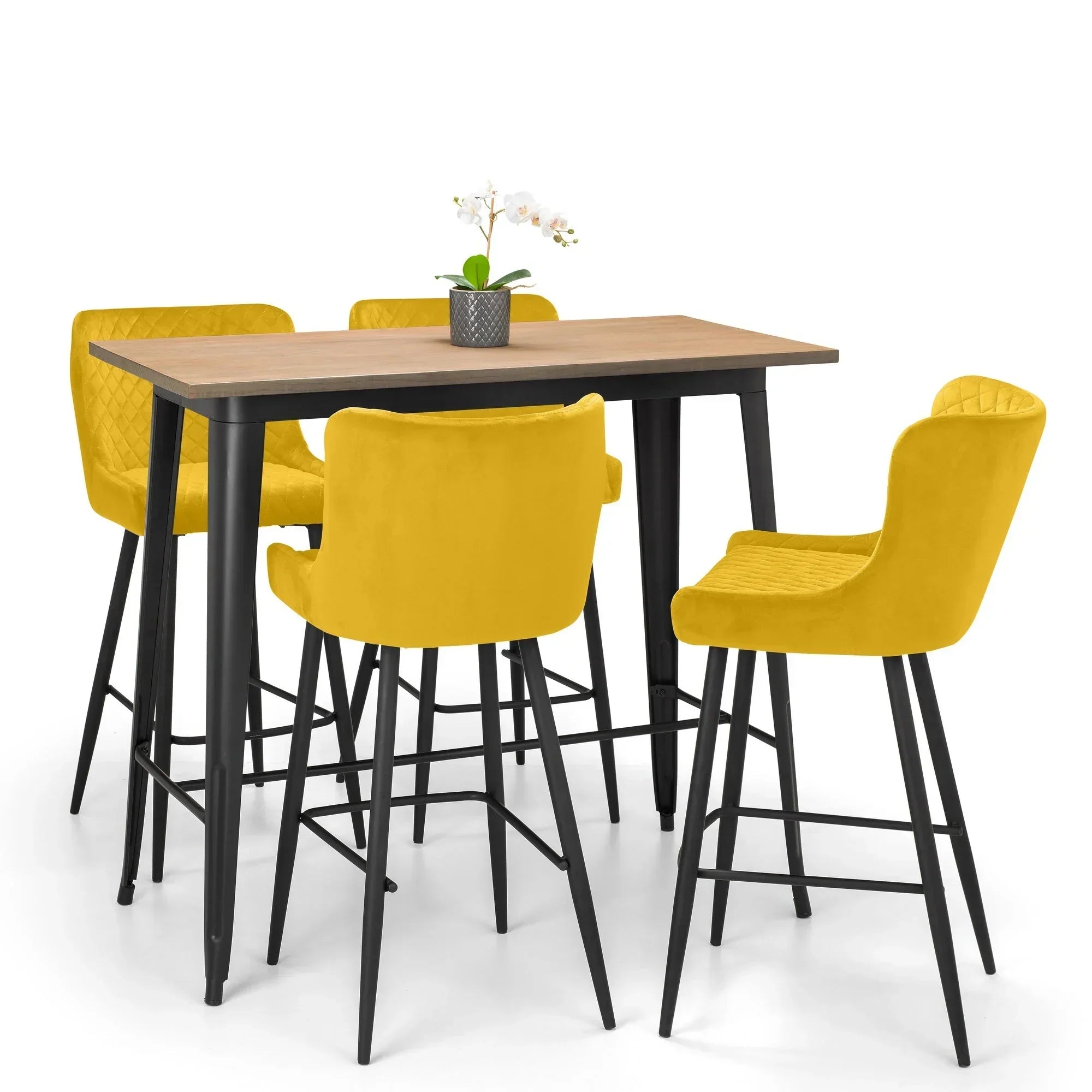 Mustard bar stools with quilted backs around a wooden bar table with metal legs