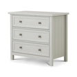 White wooden chest of drawers with three drawers and metal handles, angled side view