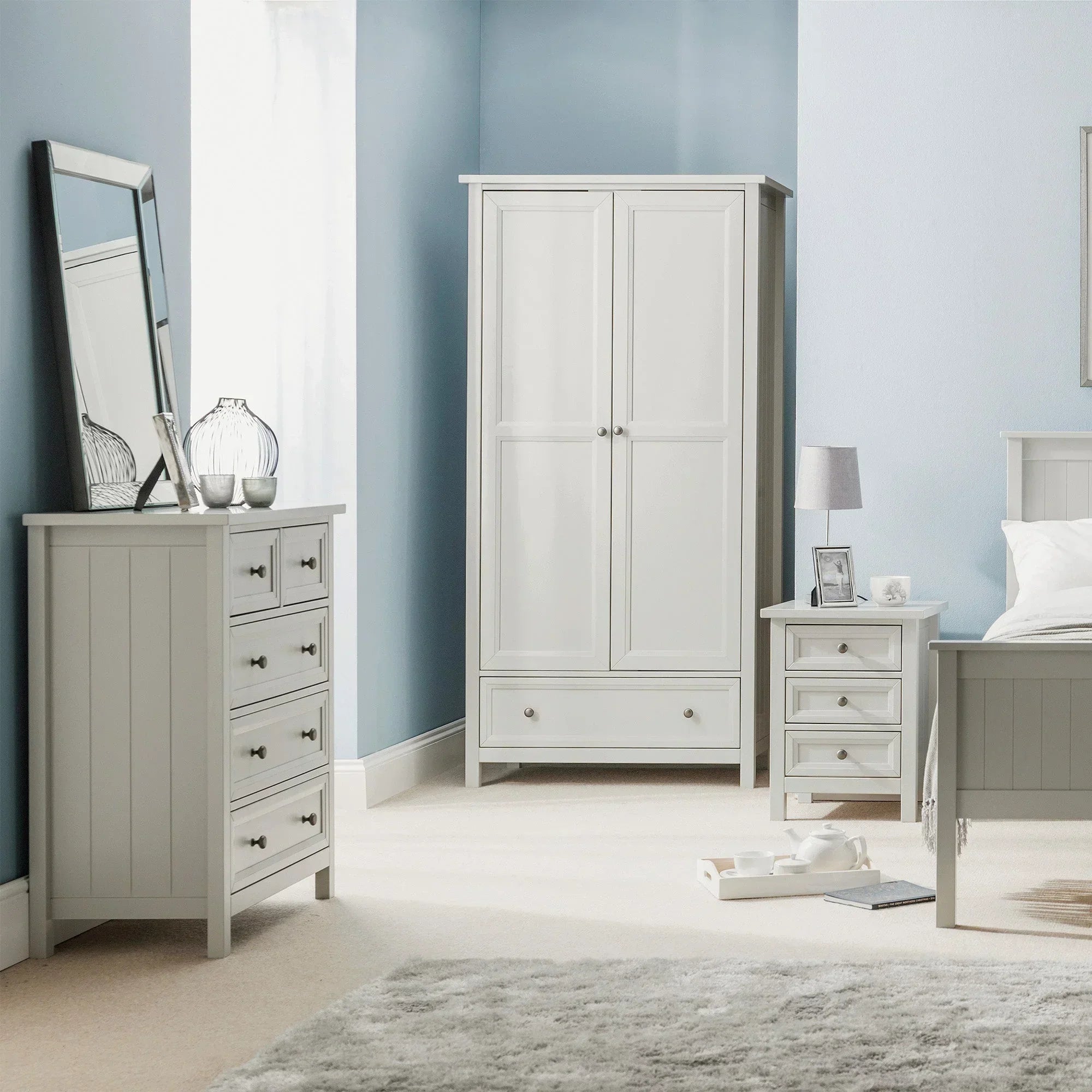Dove grey wooden bedroom furniture set with wardrobe, chest of drawers, and bedside table