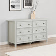 Grey wooden chest of drawers with six handles in modern living room setting