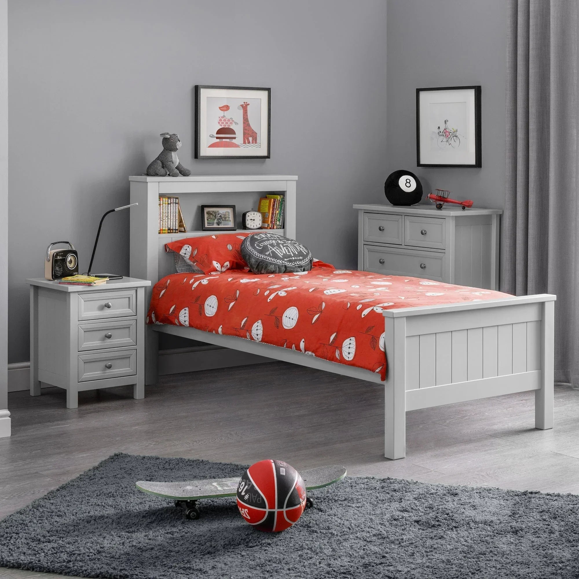 Grey bookcase bed with red bedding, bedside table, and dresser in modern bedroom