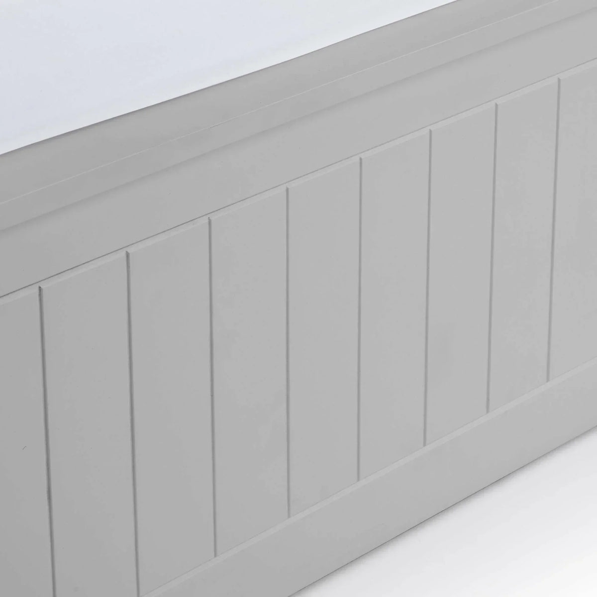 Grey wooden bed base with vertical panel detailing and smooth painted finish