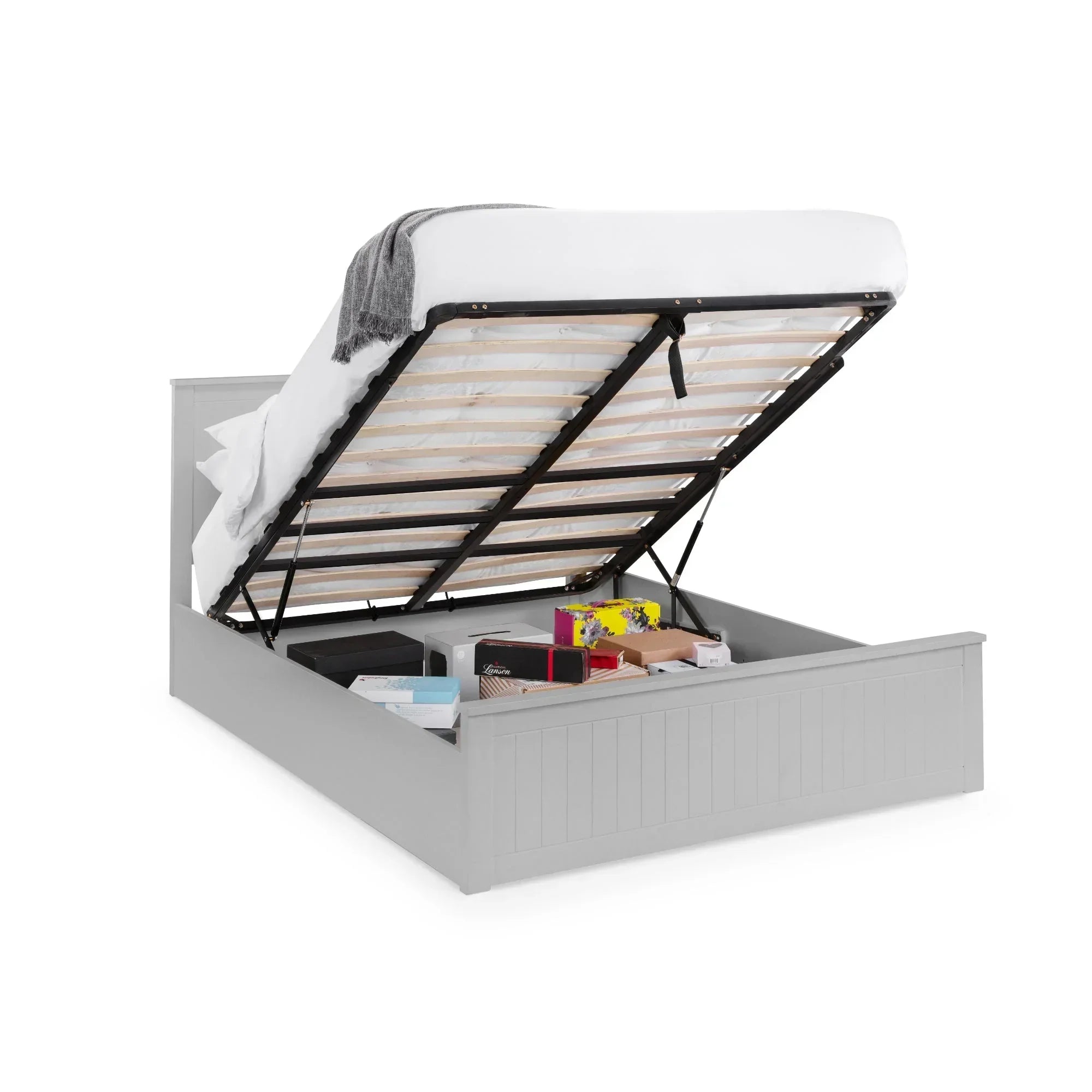 Grey ottoman storage bed with mattress lifted to show underbed storage space and boxes