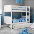 White wooden bunk bed with built-in ladder and underbed storage drawer in kids' bedroom