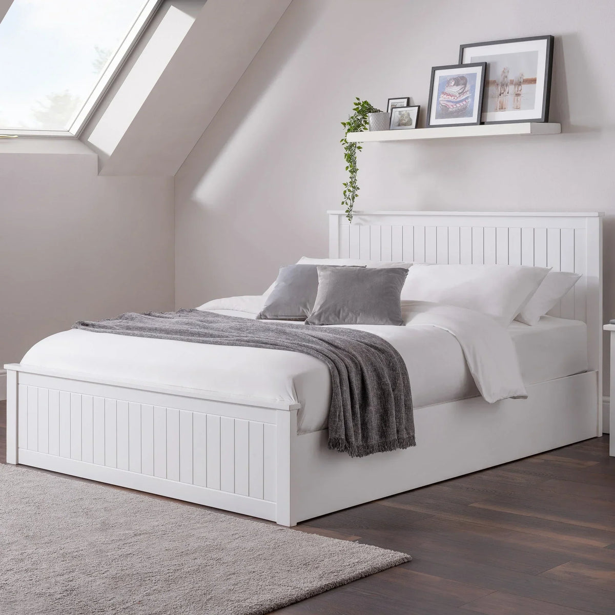 White ottoman storage double bed with panel design in modern loft bedroom