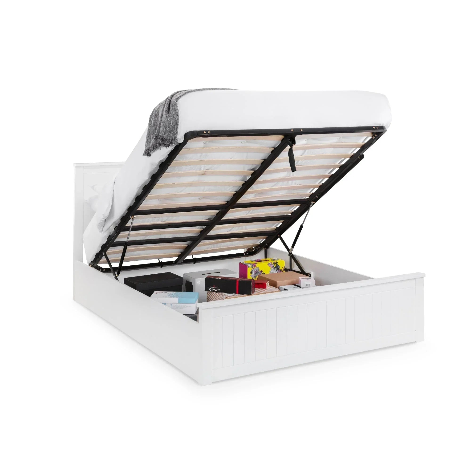 White ottoman storage bed with lift-up slatted base and assorted items stored underneath
