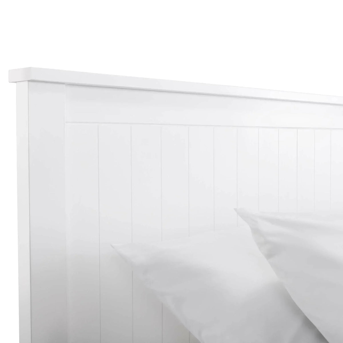 White wooden bed frame with panelled headboard and white bedding
