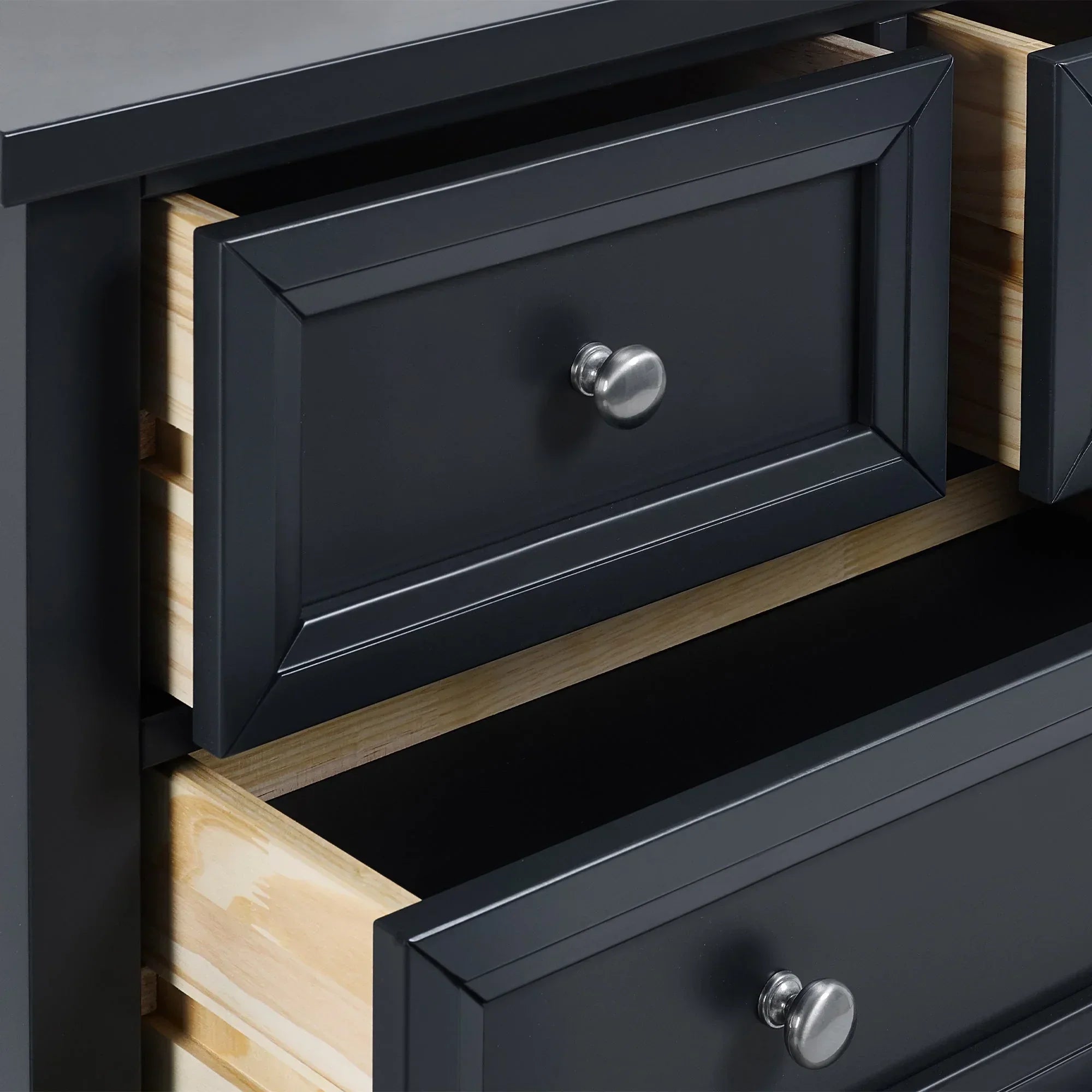 Anthracite 2 drawer chest with silver handles, close up of open drawers and wood grain sides