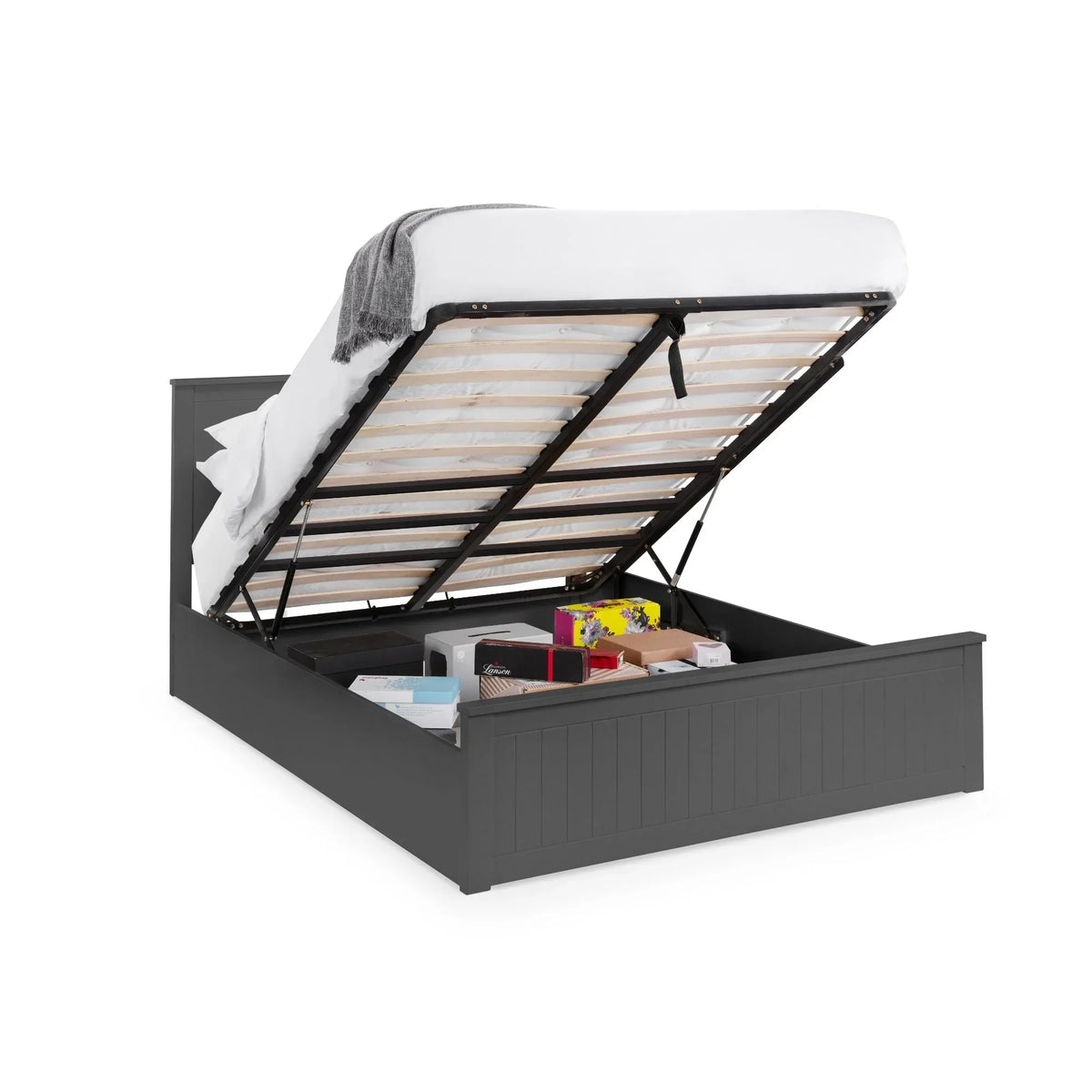 Grey ottoman storage bed with lifted mattress showing underbed storage space and items inside