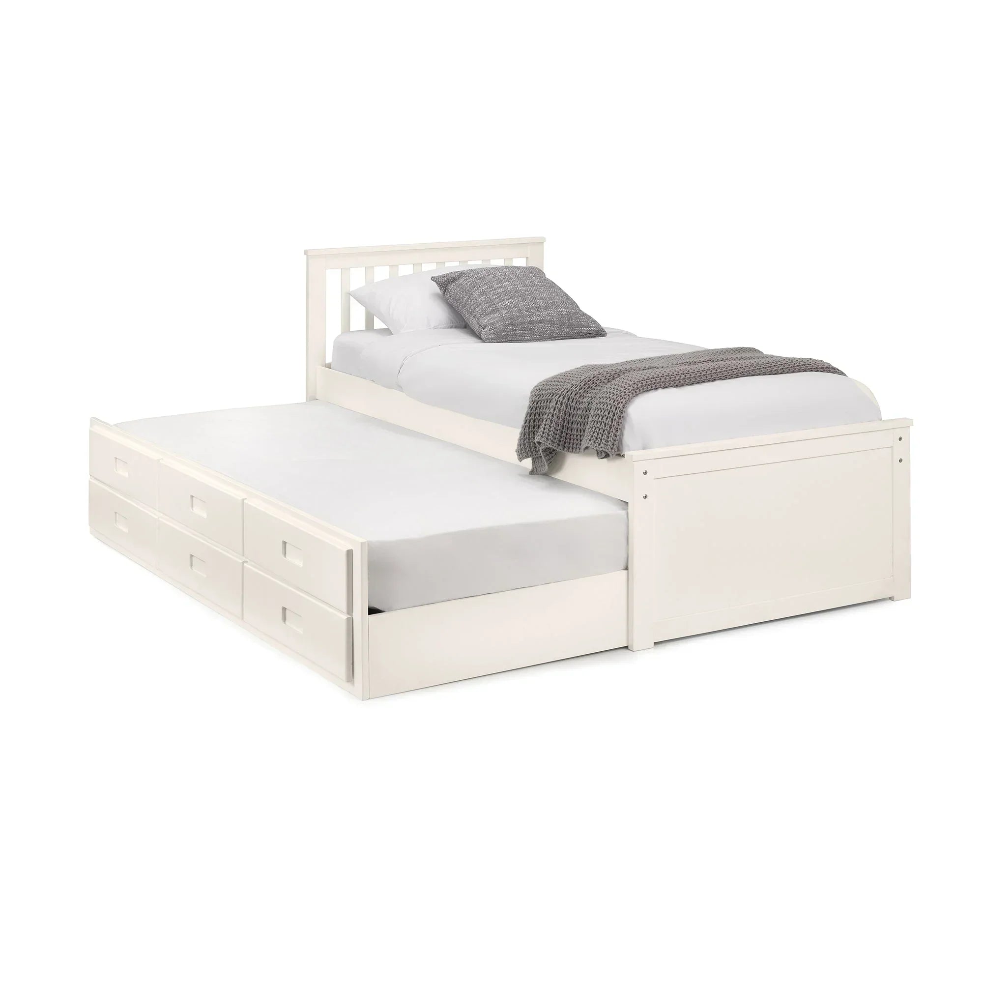 White wooden single daybed with pull-out trundle and storage drawers, bedding included