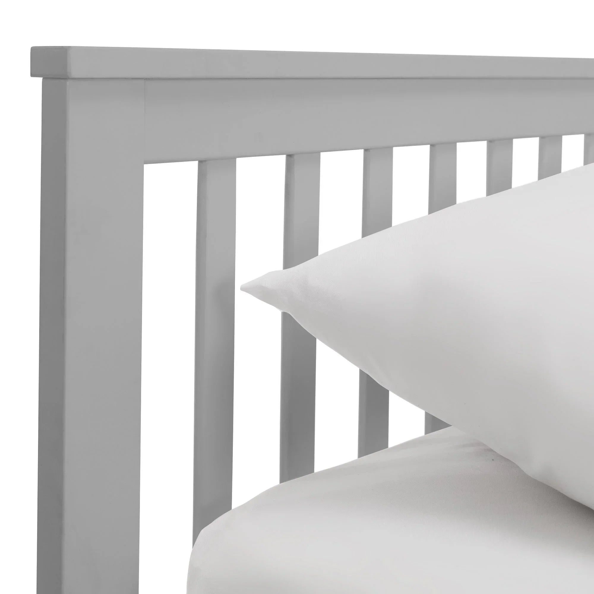 Light grey wooden daybed frame slat detail with white bedding close-up