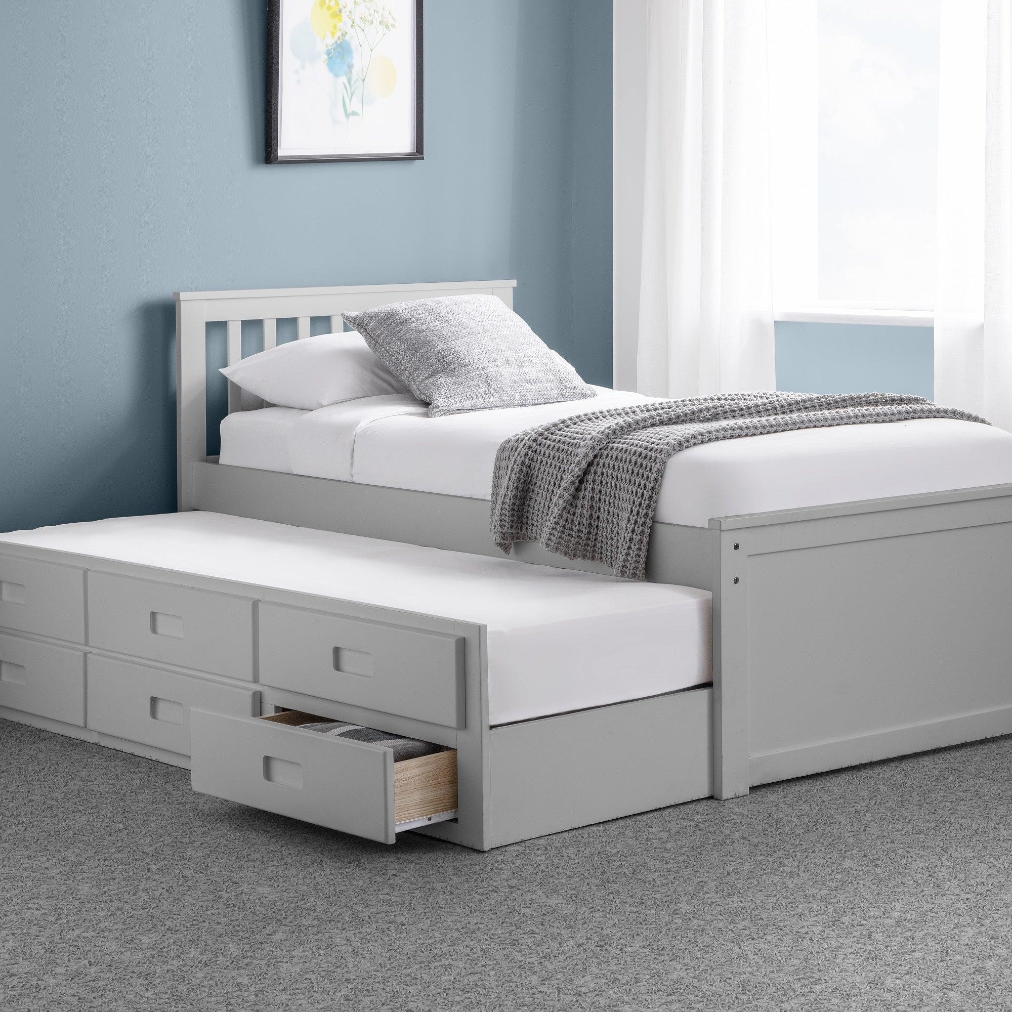 Light grey daybed with pull-out trundle bed and storage drawers in a modern bedroom