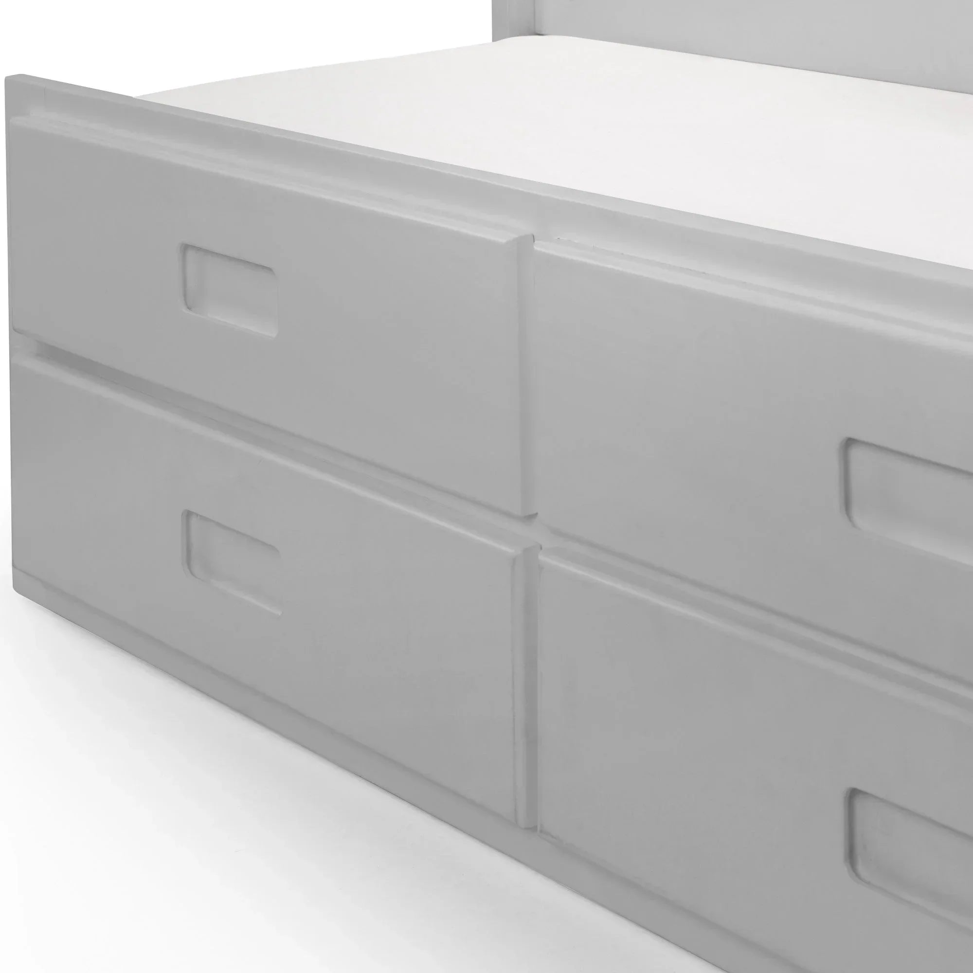 White wooden bed frame with built-in underbed storage drawers and recessed handles